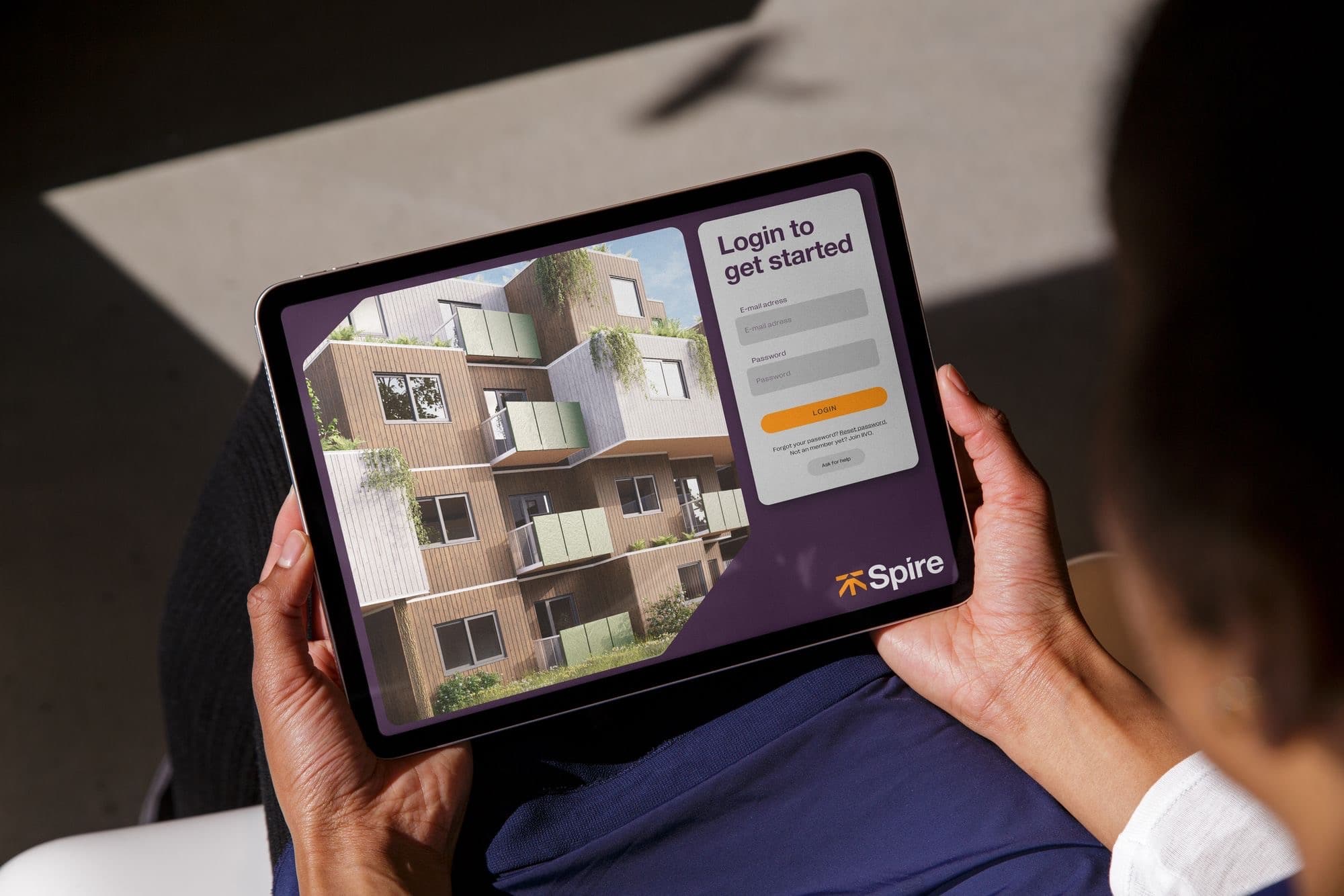 The Spire property portal open on a tablet.